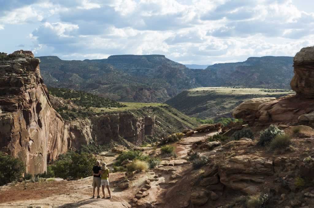 Hikers taking in the incredible view at Capitol Reef National Park, Utah